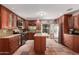 Bright kitchen boasts stainless steel appliances, a center island, and stylish backsplash at 355 E Fillmore St, Tempe, AZ 85288