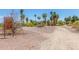 A photo of a park entrance with information signs and native landscaping with mature palm trees at 355 E Fillmore St, Tempe, AZ 85288