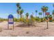 Several park signs stand in front of bushes and palm trees to inform the public about fishing water and regulations at 355 E Fillmore St, Tempe, AZ 85288