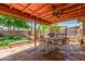 Covered patio with tiled flooring, ceiling fan, and outdoor dining set at 355 E Fillmore St, Tempe, AZ 85288