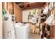 Well-lit utility room with washer, dryer, and water heater for convenience at 355 E Fillmore St, Tempe, AZ 85288