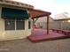 Cozy back patio with a covered seating area, perfect for enjoying the outdoors and backyard at 3601 E Taro Ln, Phoenix, AZ 85050