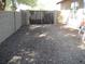Fenced backyard area featuring low-maintenance gravel landscaping, creating a private outdoor space at 3601 E Taro Ln, Phoenix, AZ 85050