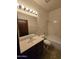 Bathroom with vanity and sink, lighting fixture, toilet, and shower/tub combination at 3601 E Taro Ln, Phoenix, AZ 85050