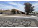 View of single-story home featuring a three-car garage and front yard desert landscaping at 3601 E Taro Ln, Phoenix, AZ 85050