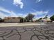 Street view of a single-story home with a three-car garage and desert landscaping at 3601 E Taro Ln, Phoenix, AZ 85050