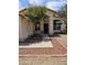Close up view of a well maintained front entrance with desert landscaping and a covered entryway at 3601 E Taro Ln, Phoenix, AZ 85050