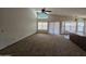 Inviting living room with high ceilings and large windows, creating a bright and airy space at 3601 E Taro Ln, Phoenix, AZ 85050