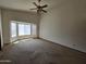 Spacious living room featuring vaulted ceilings and large windows, creating a bright and airy space at 3601 E Taro Ln, Phoenix, AZ 85050
