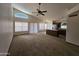 Open-concept living room featuring vaulted ceilings, large windows and seamless connection to a full kitchen at 3601 E Taro Ln, Phoenix, AZ 85050