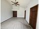 This is a spacious main bedroom with high ceilings, two large closets, and neutral carpeting at 3601 E Taro Ln, Phoenix, AZ 85050