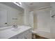 Well-lit bathroom with a shower-tub combination and a white vanity at 3604 W Calle Lejos --, Glendale, AZ 85310