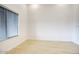 Bright, empty bedroom with hardwood floors and a large window for natural light at 3604 W Calle Lejos --, Glendale, AZ 85310