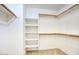Walk-in closet featuring built-in shelving and ample storage space at 3604 W Calle Lejos --, Glendale, AZ 85310