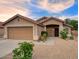 Inviting single-story home featuring a two-car garage and desert landscaping at 3604 W Calle Lejos --, Glendale, AZ 85310