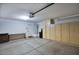 Spacious garage featuring ample storage cabinets and work area at 3604 W Calle Lejos --, Glendale, AZ 85310