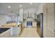 Modern kitchen featuring stainless steel appliances, sleek cabinetry, and a breakfast bar at 3604 W Calle Lejos --, Glendale, AZ 85310