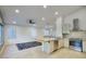 Open kitchen with stainless steel appliances, a breakfast bar, and an open layout at 3604 W Calle Lejos --, Glendale, AZ 85310