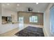 Open floor plan with modern kitchen, dining and living areas and outdoor access at 3604 W Calle Lejos --, Glendale, AZ 85310