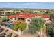 Aerial view of the property showcasing the pool, patio, mature landscaping, and neighborhood at 37440 N 104Th Pl, Scottsdale, AZ 85262