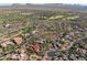 Wide aerial shot of the community and its surrounding area, showing golf courses and desert landscaping at 37440 N 104Th Pl, Scottsdale, AZ 85262