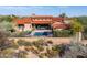 Expansive aerial view of the property featuring a pool, covered patio, and red tile roof at 37440 N 104Th Pl, Scottsdale, AZ 85262