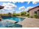 Beautiful backyard with a sparkling pool, spa, and lush landscaping providing a serene and private outdoor retreat at 37440 N 104Th Pl, Scottsdale, AZ 85262