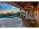Beautiful backyard with a sparkling pool, comfortable lounge chairs, and lush landscaping at 37440 N 104Th Pl, Scottsdale, AZ 85262