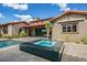 Relaxing backyard with a refreshing pool, a bubbling spa, and lush greenery creating a private oasis for outdoor enjoyment at 37440 N 104Th Pl, Scottsdale, AZ 85262