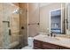 Modern bathroom showcasing a glass shower, vanity with sink, and beautiful tile work at 37440 N 104Th Pl, Scottsdale, AZ 85262