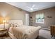 Inviting bedroom featuring a decorative bed frame, plush bedding, soft lighting, and cozy ambiance at 37440 N 104Th Pl, Scottsdale, AZ 85262
