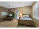 Bedroom with desk, ensuite bath, and doors to the outside at 37440 N 104Th Pl, Scottsdale, AZ 85262