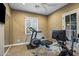 Home gym with exercise equipment, natural light, and neutral color scheme creating a clean, motivating space at 37440 N 104Th Pl, Scottsdale, AZ 85262