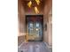 Elegant front entryway featuring a decorative metal and glass double door, and recessed lighting at 37440 N 104Th Pl, Scottsdale, AZ 85262
