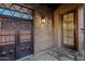 Stately front entrance featuring a secure decorative gate and beautiful brickwork at 37440 N 104Th Pl, Scottsdale, AZ 85262