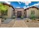 Attractive single Gathering home with a landscaped yard, desert plants and a brick walkway to the entry at 37440 N 104Th Pl, Scottsdale, AZ 85262