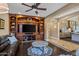 Cozy living room with custom built-ins, recessed lighting, and views of the kitchen and hallway at 37440 N 104Th Pl, Scottsdale, AZ 85262