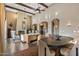 An expansive living area showcases a stone fireplace, wood beams, and an open floor plan at 37440 N 104Th Pl, Scottsdale, AZ 85262