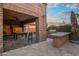 The patio has a pool table, a grill, and a built-in bar, perfect for outdoor entertaining and fun at 37440 N 104Th Pl, Scottsdale, AZ 85262