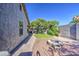 Private backyard featuring a fire pit, rock landscaping, and green lawn space at 3790 W White Canyon Rd, San Tan Valley, AZ 85144