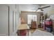 Cozy bedroom featuring natural light, wood floors, and ample storage space at 3790 W White Canyon Rd, San Tan Valley, AZ 85144