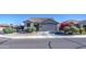 Charming single-story home with desert landscaping and a tile roof under a clear blue sky at 3790 W White Canyon Rd, San Tan Valley, AZ 85144