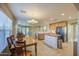 Open-concept kitchen features modern appliances, tile flooring, and a dining area at 3790 W White Canyon Rd, San Tan Valley, AZ 85144