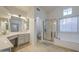 Spacious bathroom includes double sinks, a soaking tub, and a glass shower enclosure at 3834 E Windsong Dr, Phoenix, AZ 85048