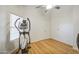 Bright bedroom features wood floors, white walls, and a ceiling fan at 3834 E Windsong Dr, Phoenix, AZ 85048