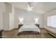 Inviting bedroom features natural light, neutral color palette, and cozy carpet at 3834 E Windsong Dr, Phoenix, AZ 85048