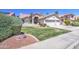 Attractive single-Gathering home boasts a lush, green lawn and a three-car garage, showcasing curb appeal at 3834 E Windsong Dr, Phoenix, AZ 85048