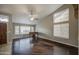 Large living room with hardwood floors, a piano, and plenty of natural light at 3834 E Windsong Dr, Phoenix, AZ 85048