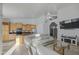 Spacious living room with tile flooring, high ceilings, and an open layout to the kitchen at 3834 E Windsong Dr, Phoenix, AZ 85048