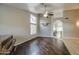 Sunlit living room features hardwood floors, vaulted ceilings, piano and open floor plan at 3834 E Windsong Dr, Phoenix, AZ 85048